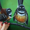 new zealand fantails piwakaka birds oil painting with green background by nicola mcleay fine art